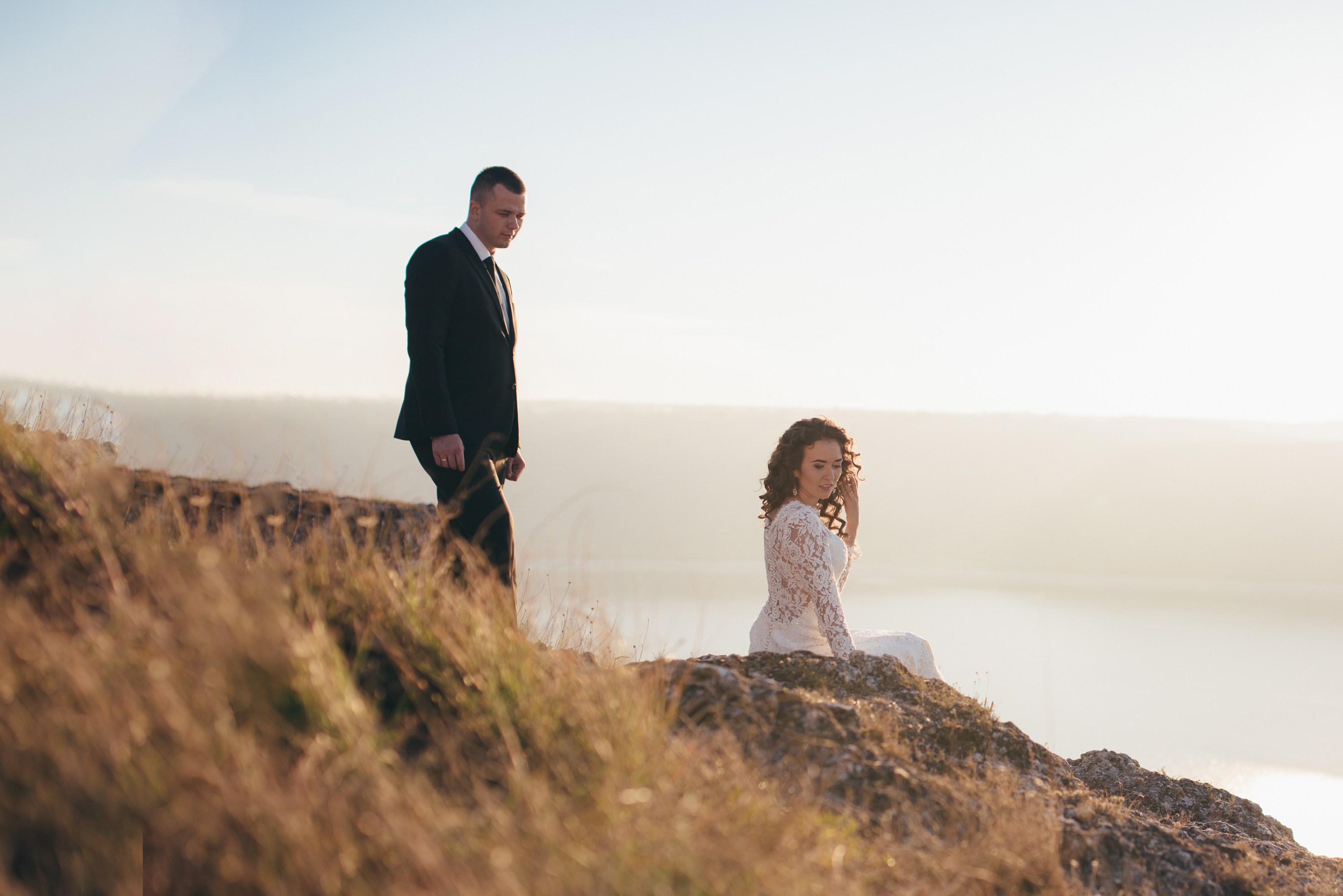 Couple on a cliff during golden light in Iceland