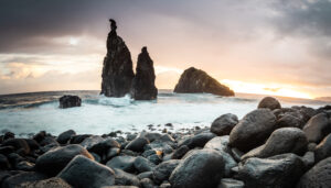 Ribeira da Janela. Volcanic rock formations standing the Atlantic Ocean at dramatic sunrise, Madeira Island, Portugal