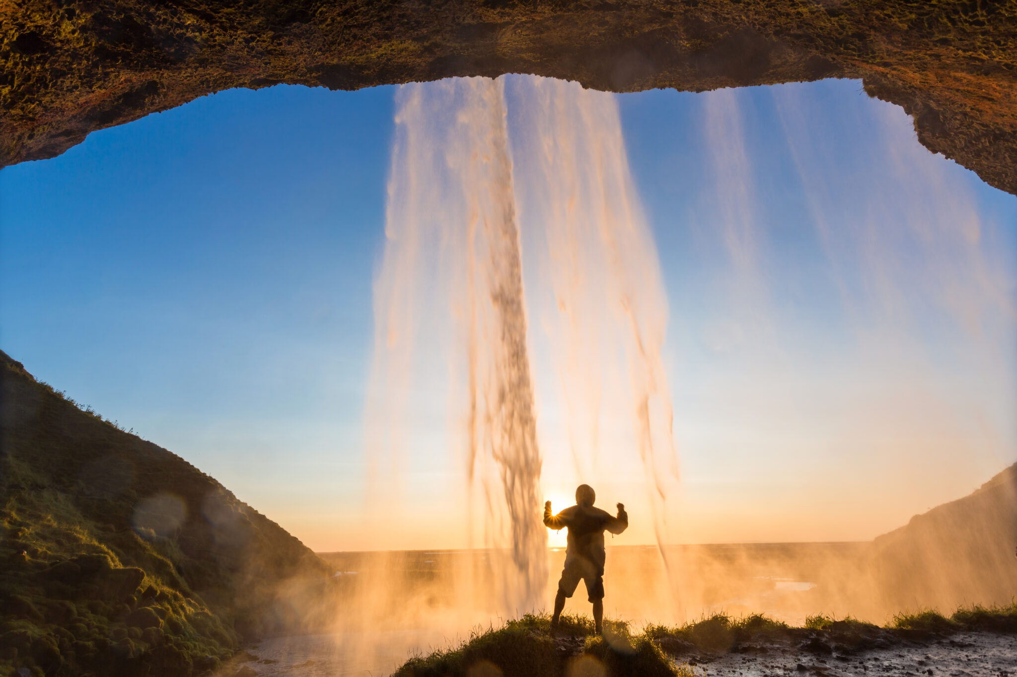 Man behind Seljalandsfoss Waterfall, South Iceland, Iceland